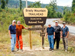 Traildogs showing off the new sign along Brady Mountain Road.